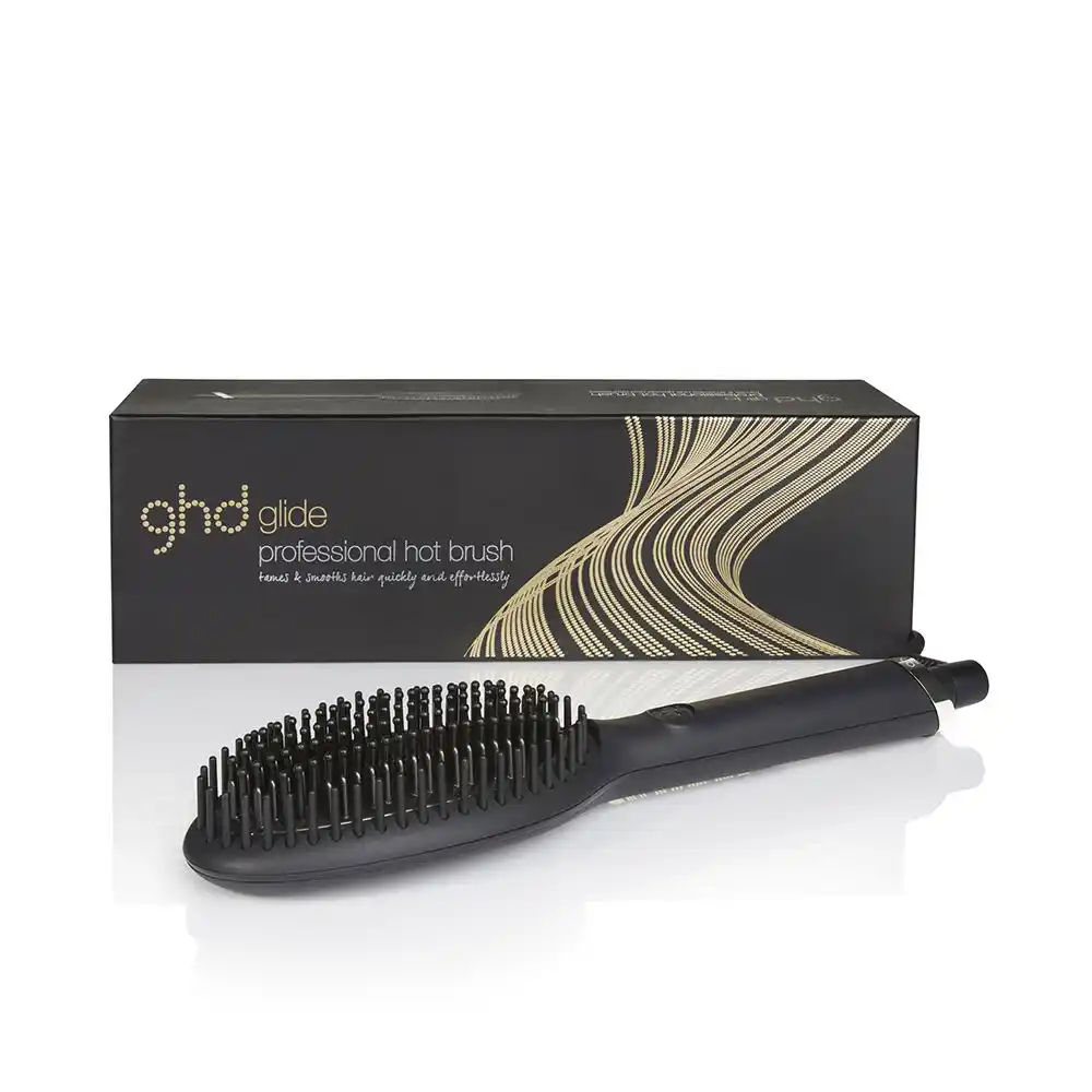 Brosse lissante noire ghd Glide présentée devant son emballage.